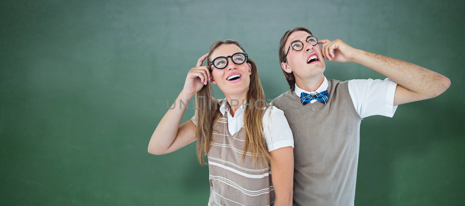 Composite image of geeky hipsters looking confused  by Wavebreakmedia