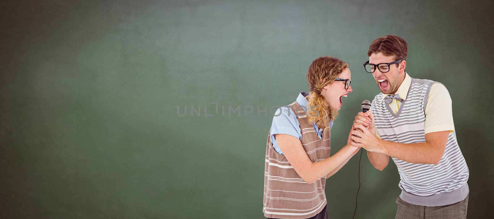 Composite image of geeky hipster couple singing into a microphone by Wavebreakmedia