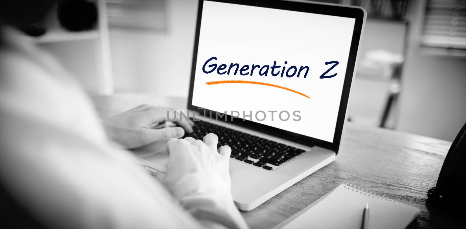 The word generation z against businessman working on his laptop