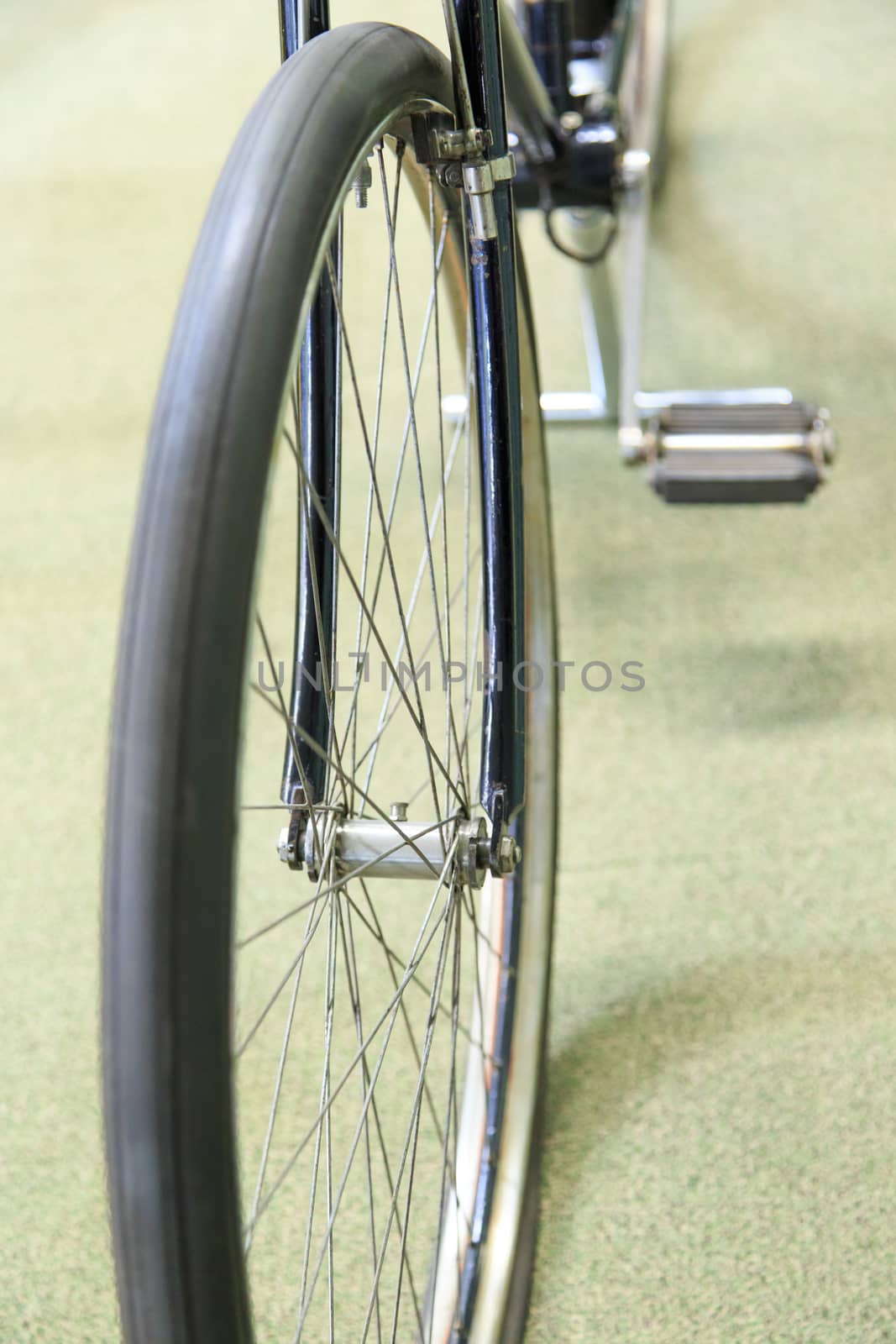 Close up detailed view of steering wheelsand rims of vintage bicycle.