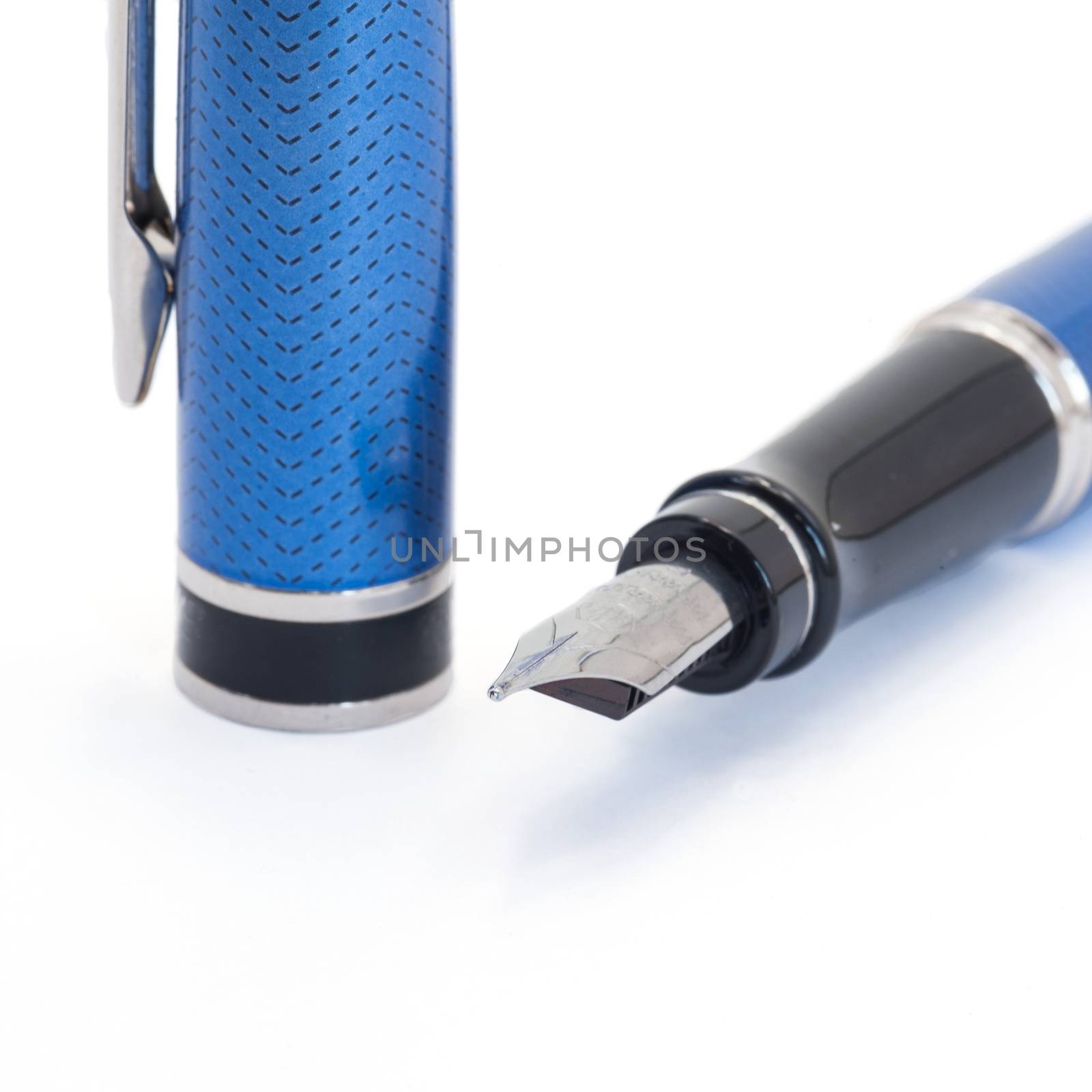 Beautiful blue ink pen on pure white background