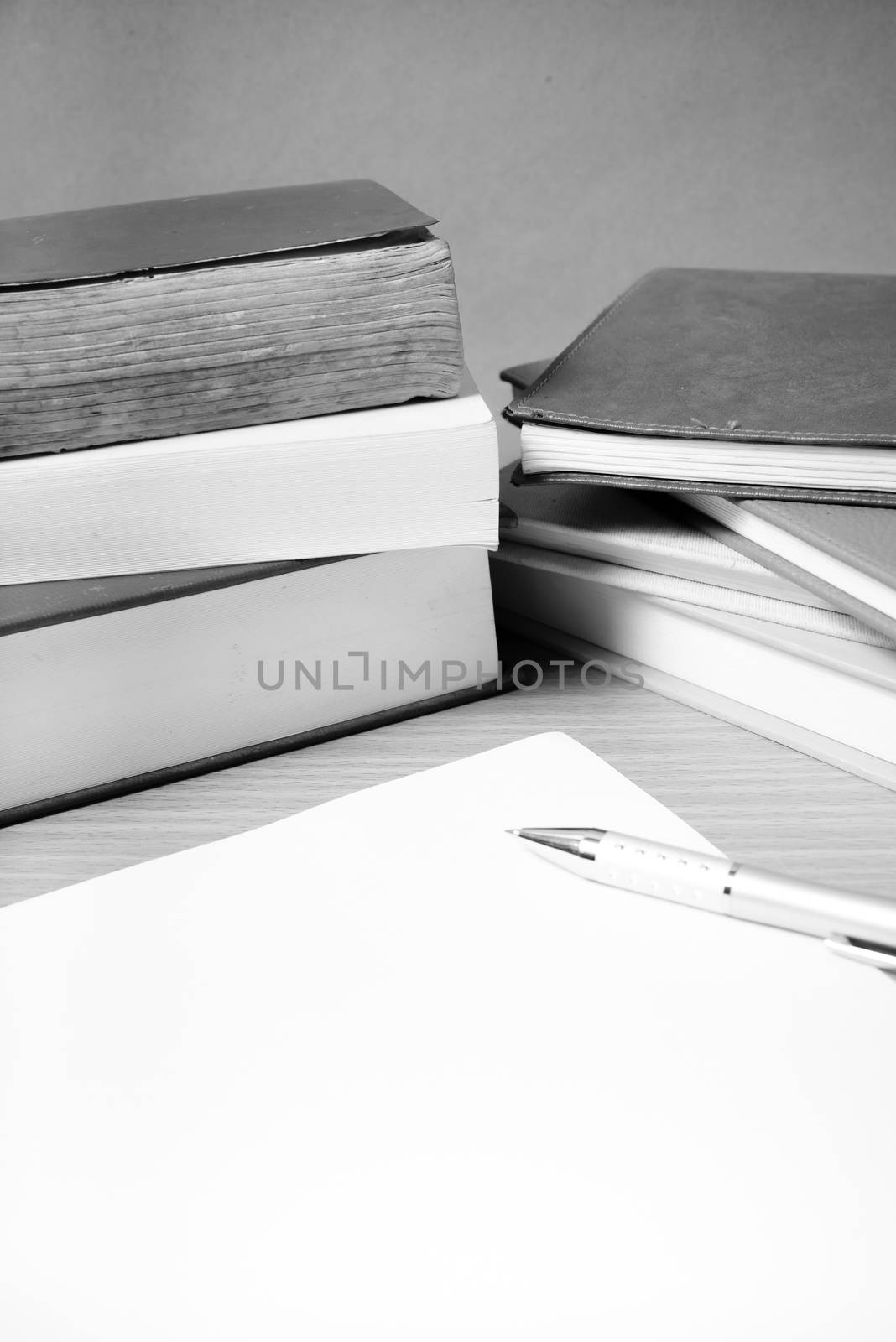 empty paper and pen with book black and white tone style by ammza12