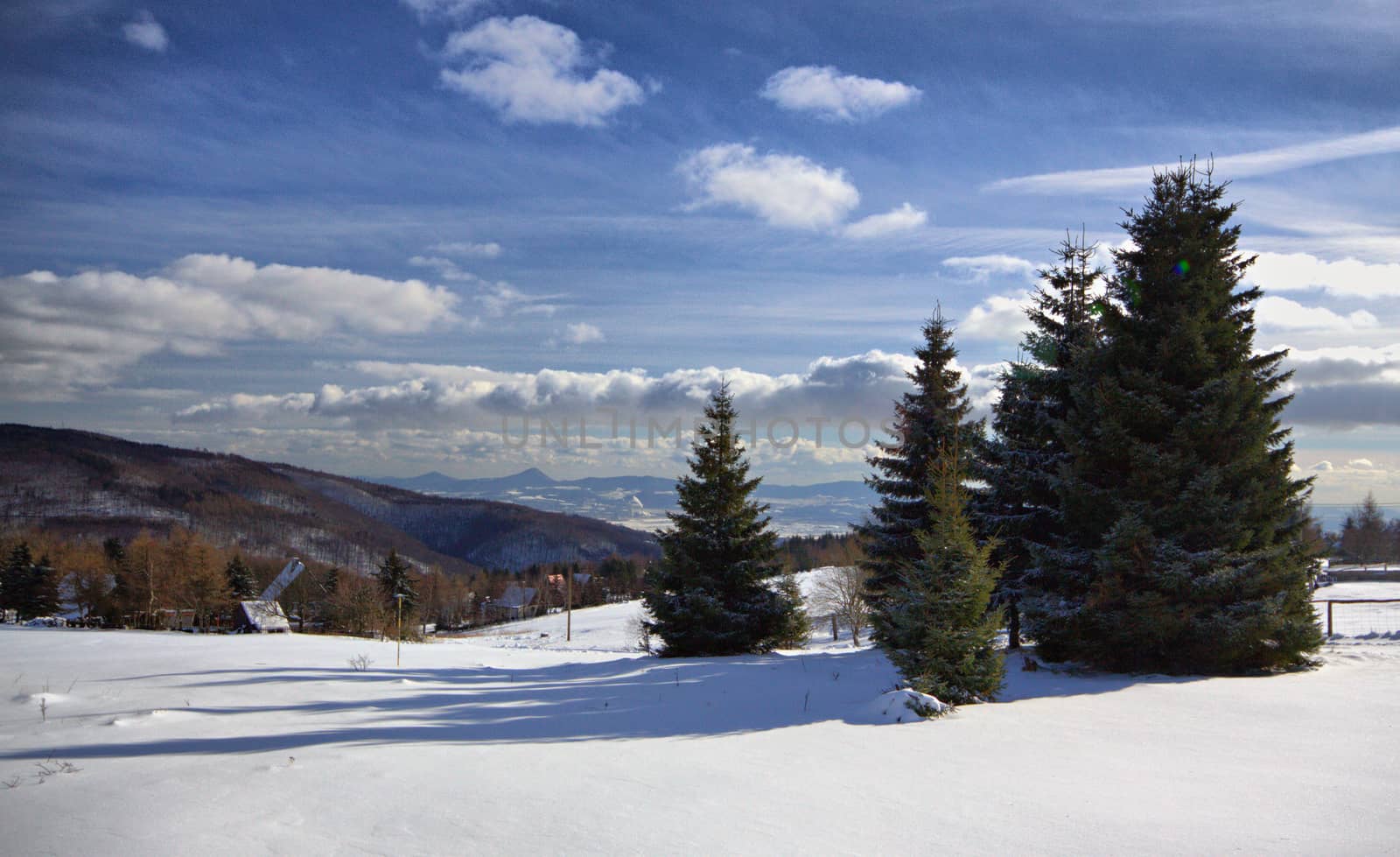 Landscape in winter on czech mountain and blue sky