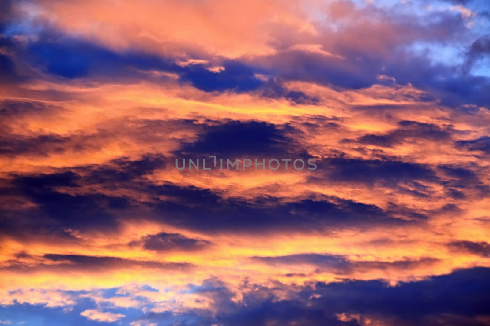 Beautiful Bright orange ,blue and yellow colors sunset sky. 