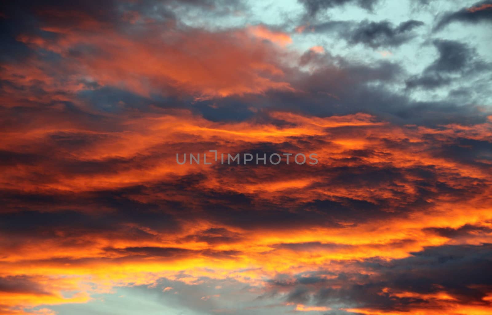 Beautiful Bright orange ,blue and yellow colors sunset sky. 