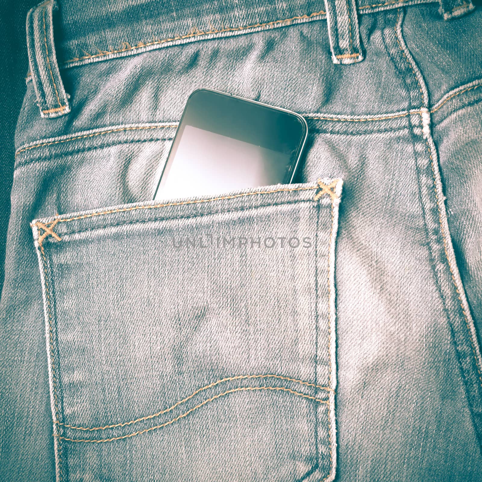 smart phone in jean pocket pants retro vintage style