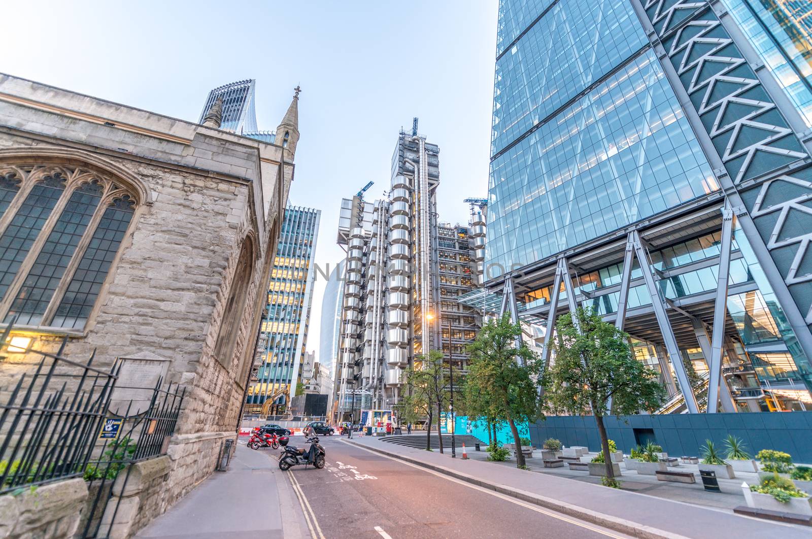 LONDON - JUNE 12, 2015: City of London skyline at dusk. London attracts 50 million people annually.