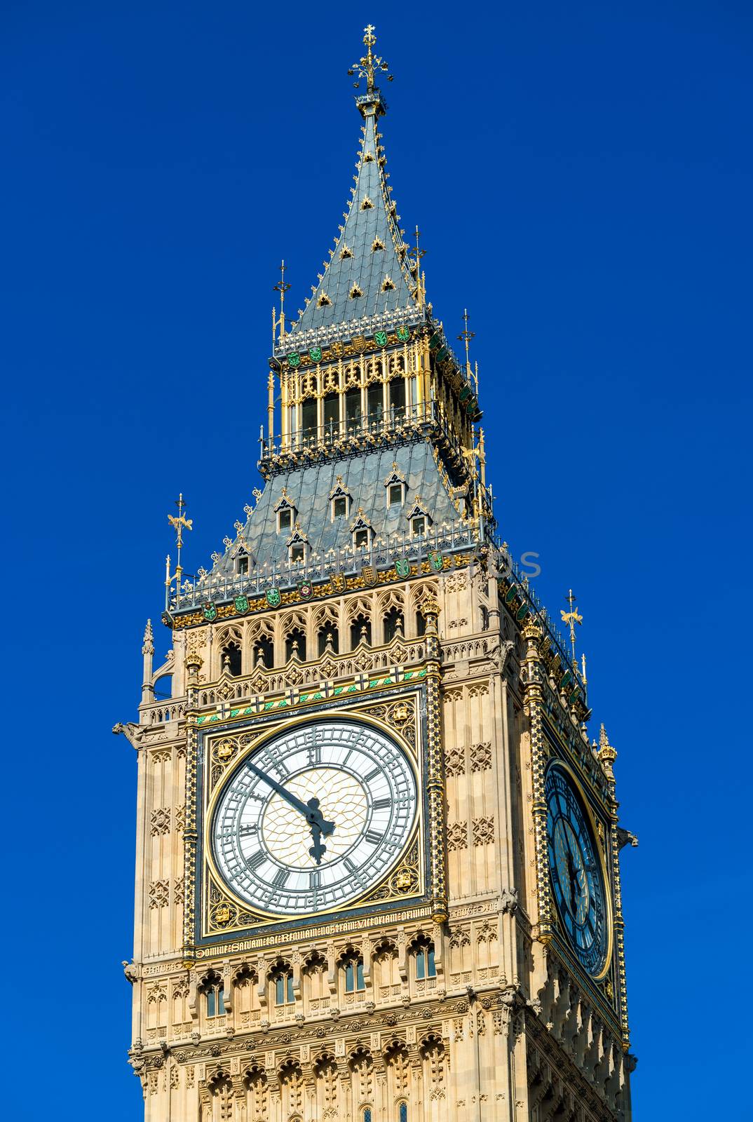 Big Ben Tower in London against blue sky by jovannig