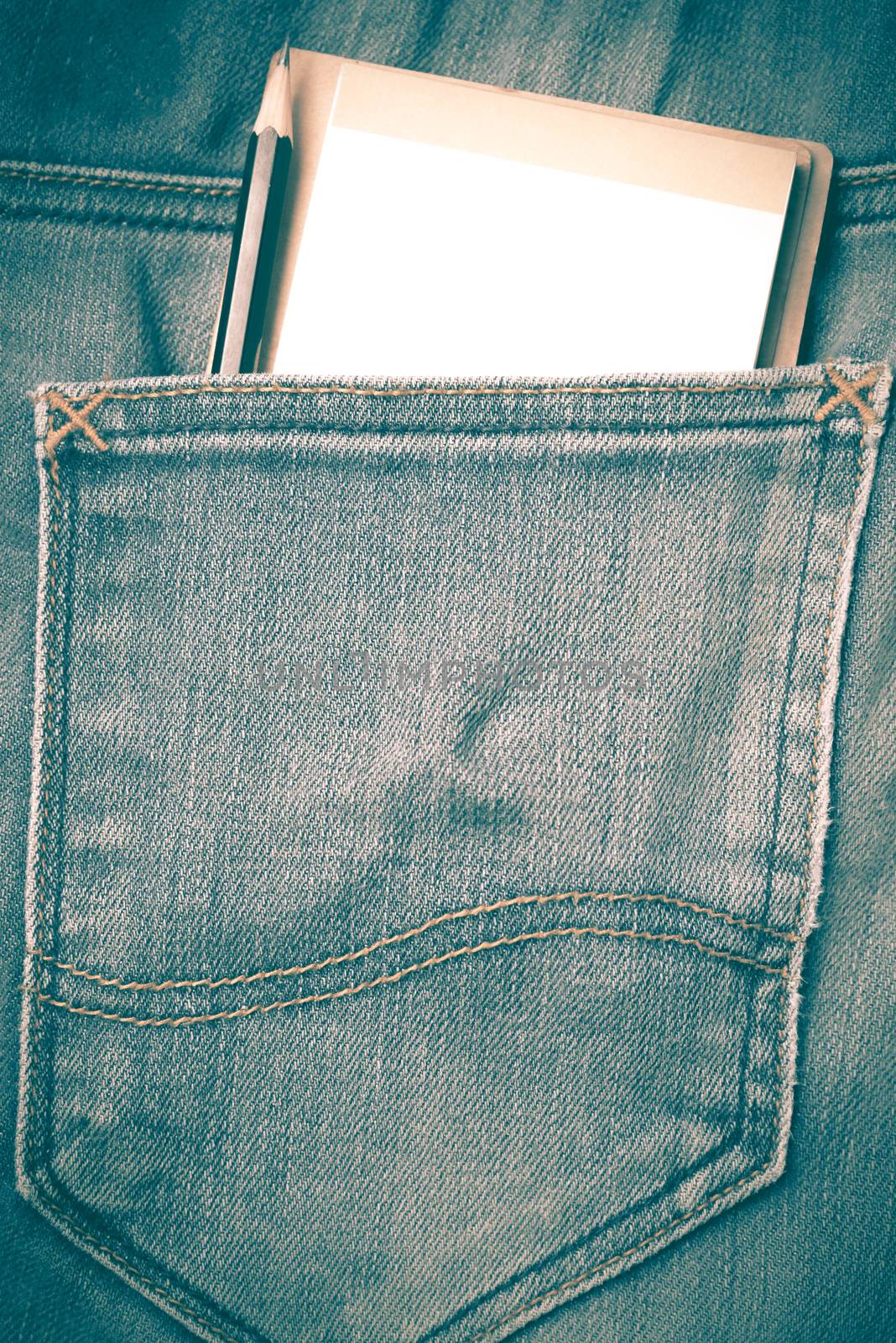 notebook and pencil in jean pocket retro vintage style