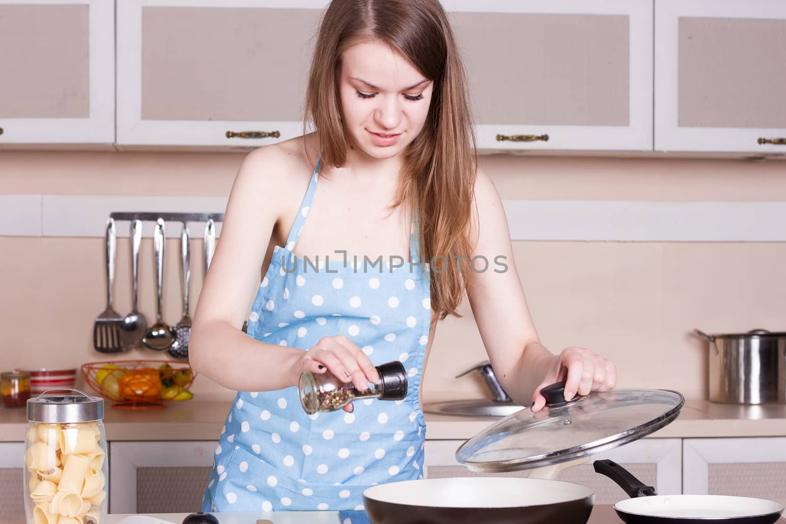 Girl in the kitchen preparing by victosha