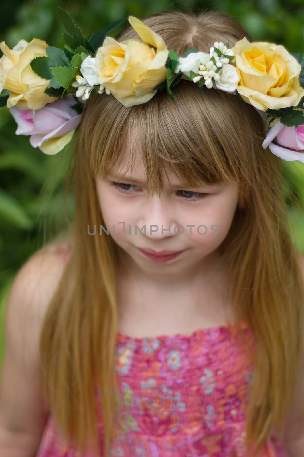 Girl 6 years old with long hair wearing a crown