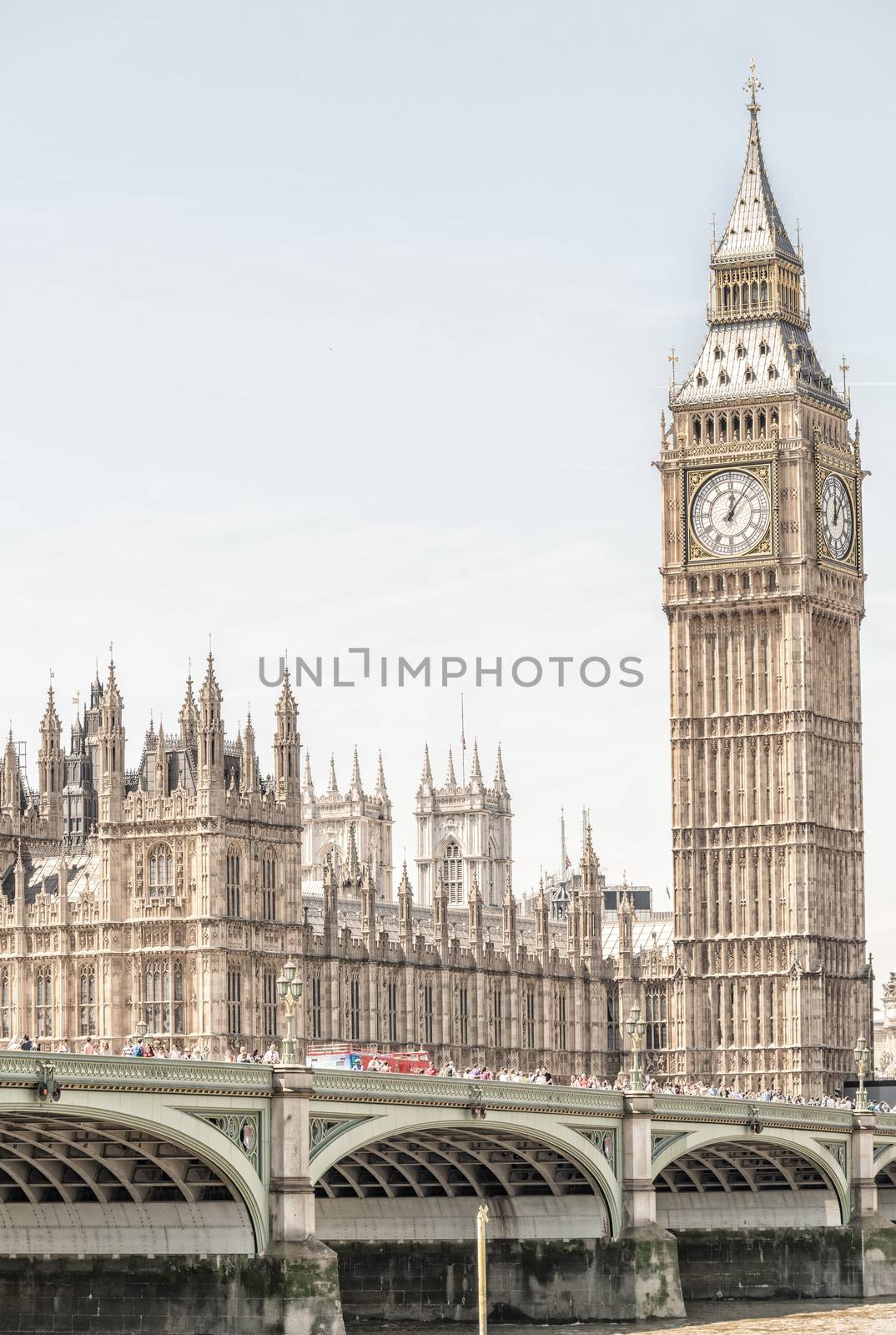 LONDON - JUNE 14, 2015: Tourists near Westminster Bridge. London is visited by 50 million people annually.