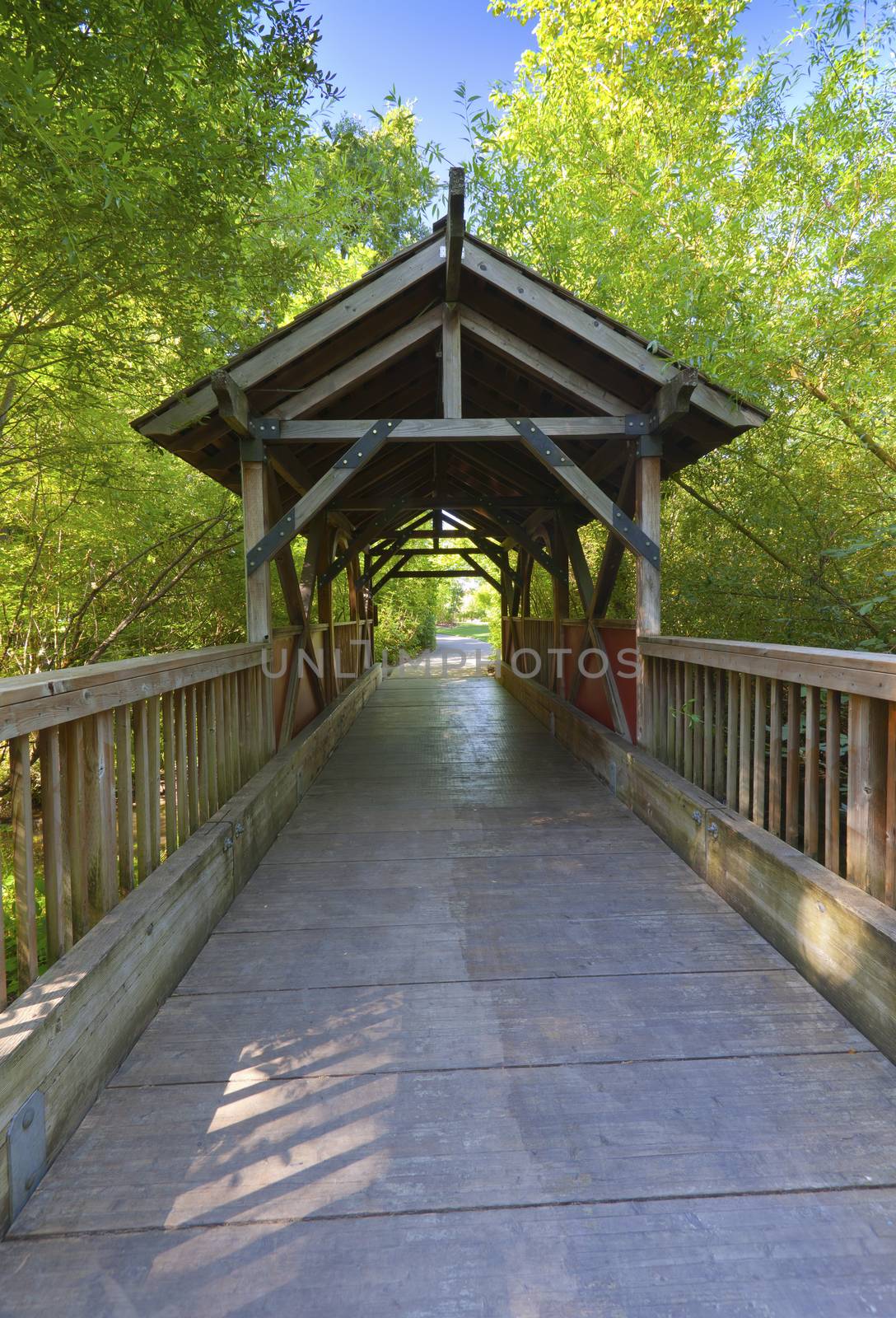 Small wooden covered bridge in Fairview Village Oregon.