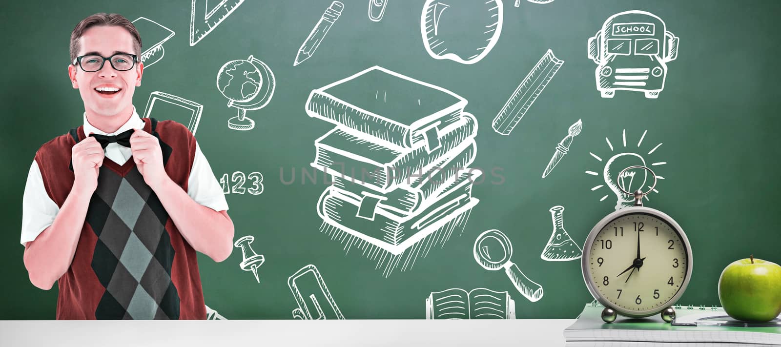 Geeky hipster fixing his bow tie against green chalkboard