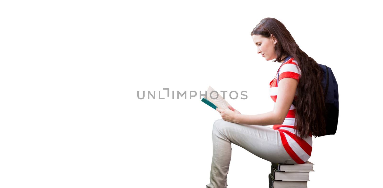 Student reading book in library against white background with vignette