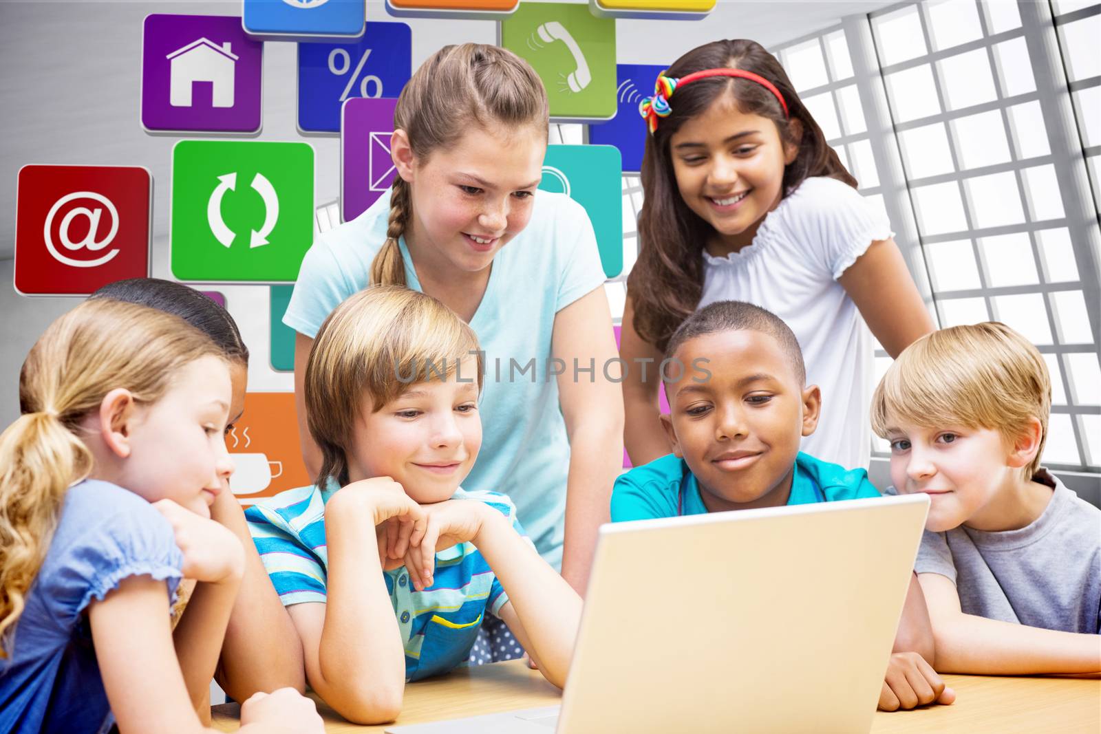 Cute pupils using tablet computer in library against abstract room