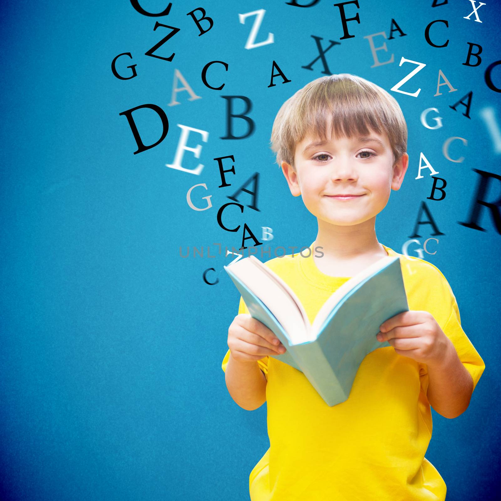 Composite image of happy pupil with book by Wavebreakmedia