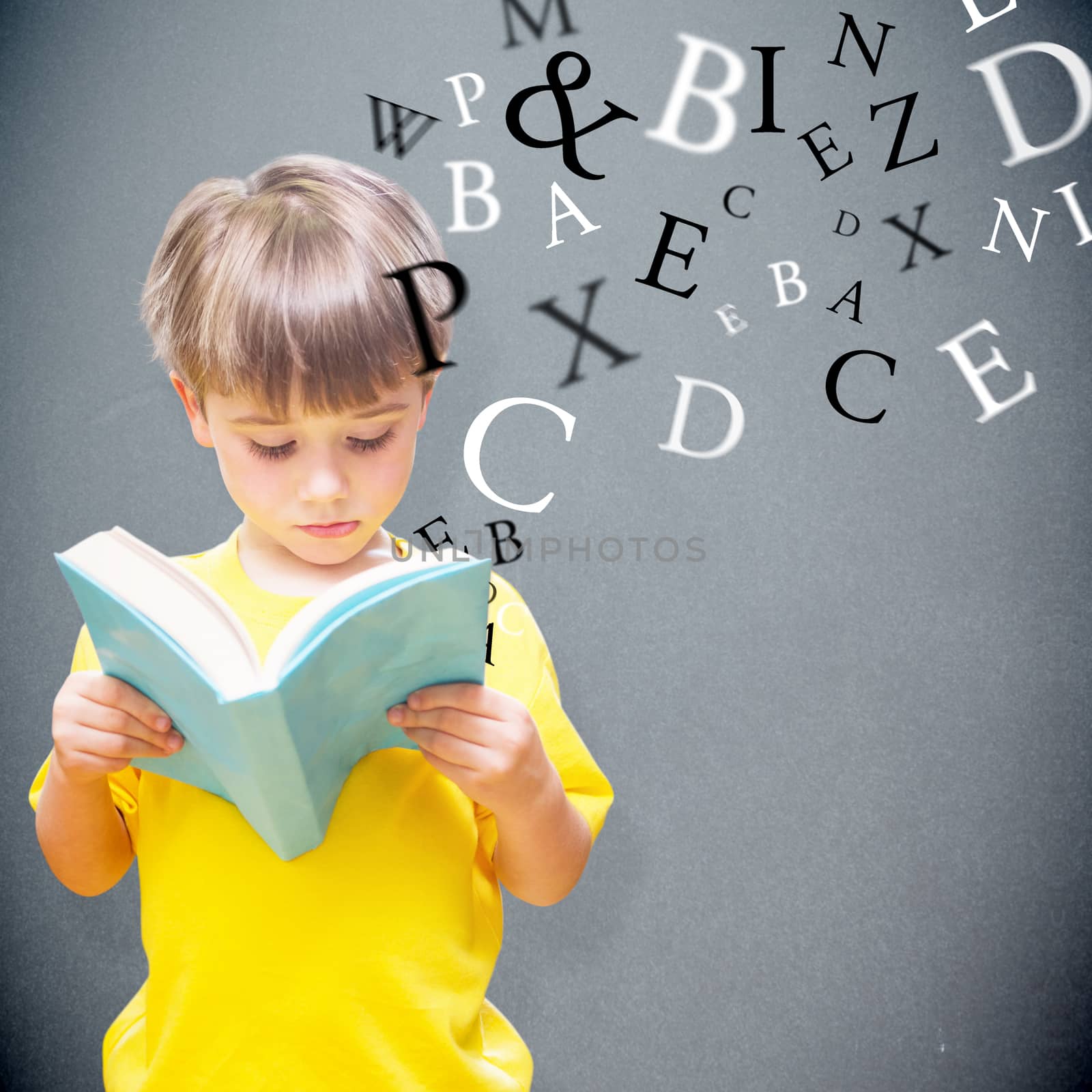 Pupil reading book against grey background