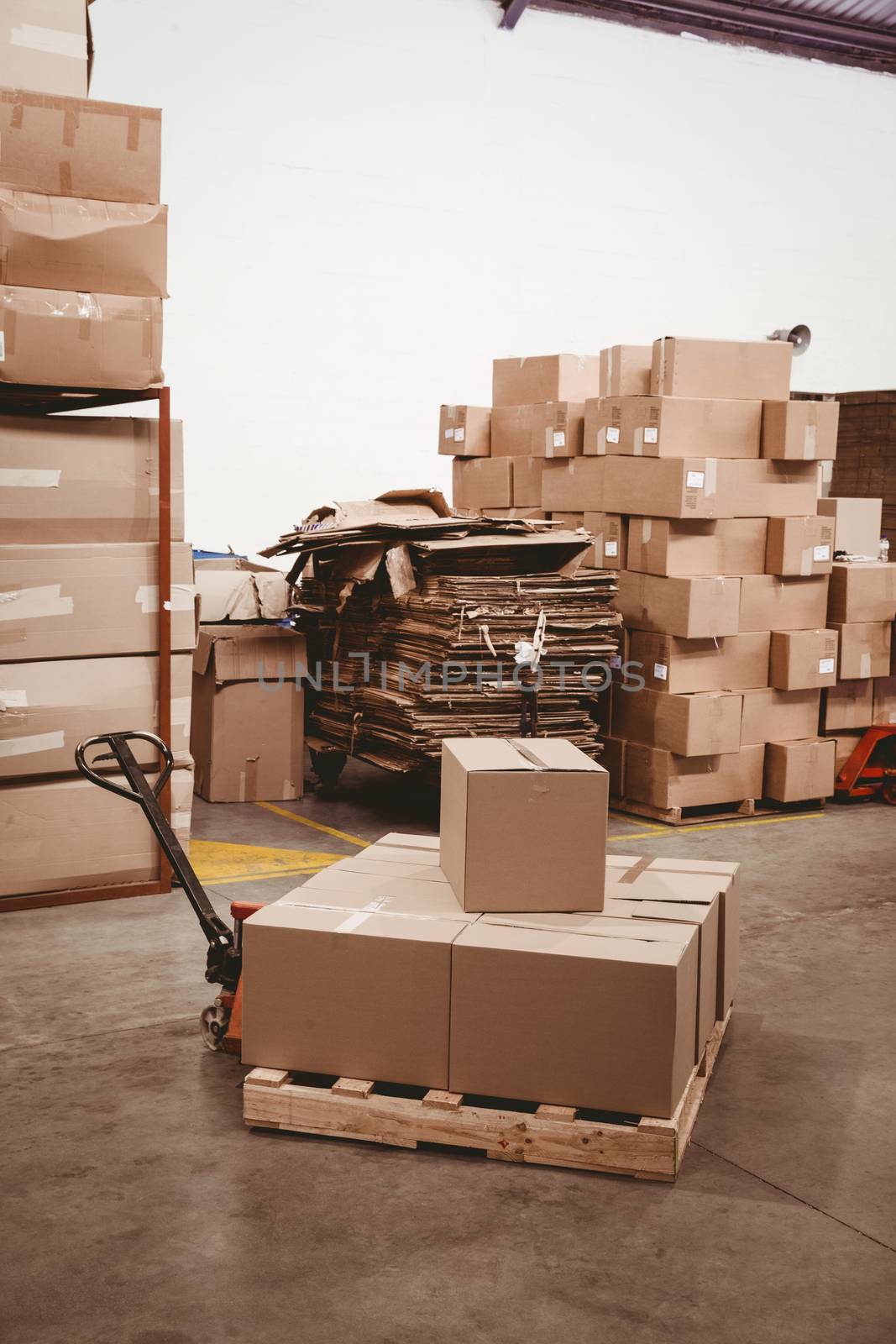 Cardboard boxes in warehouse by Wavebreakmedia