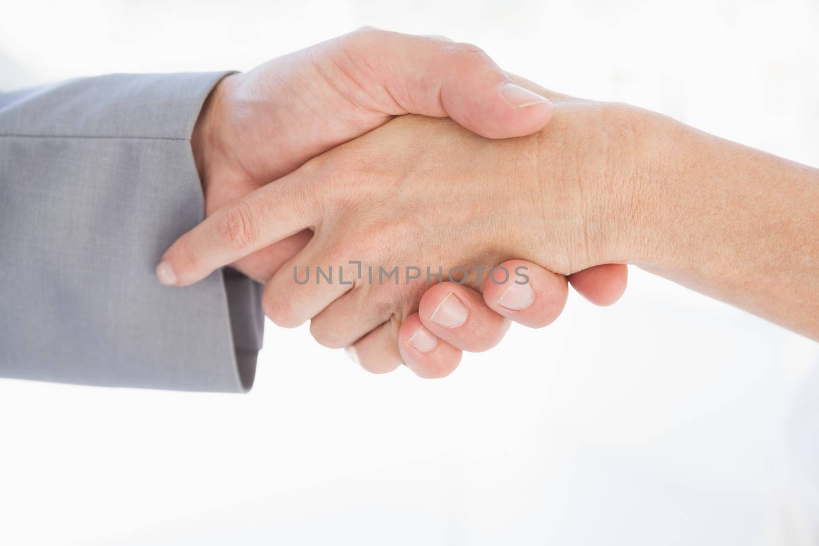 Close up of business people shaking hands 