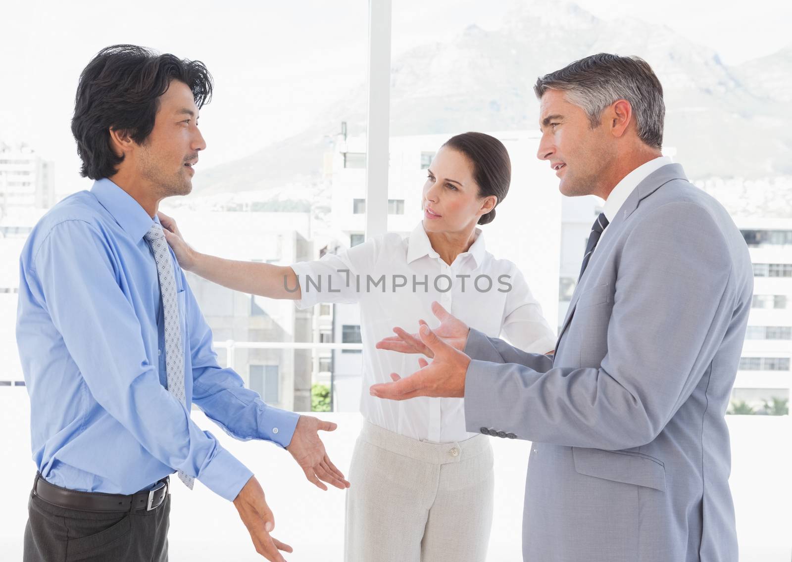 Business people having an argument by Wavebreakmedia