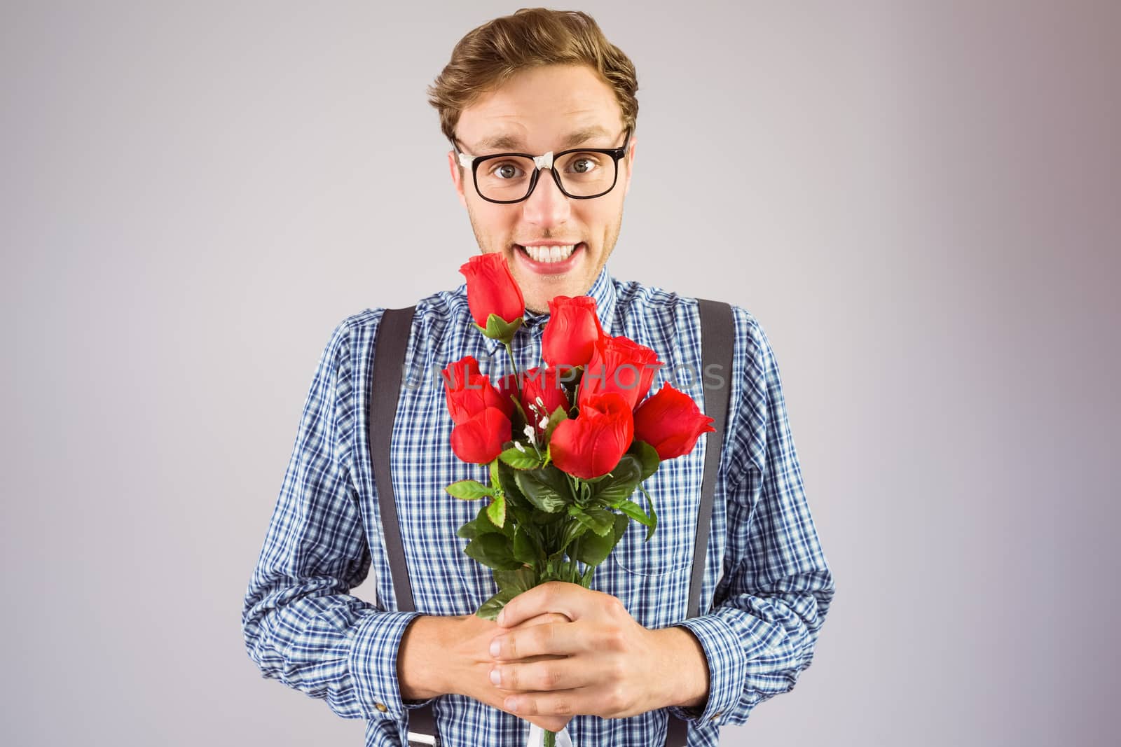 Geeky hipster holding a bunch of roses by Wavebreakmedia