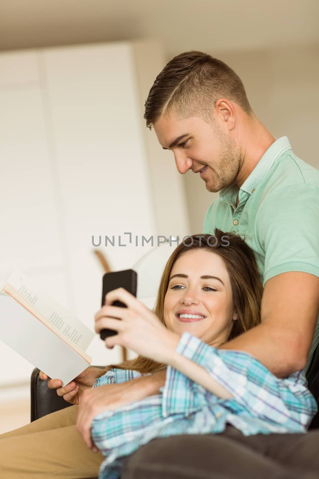 Cute couple relaxing on couch at home in the living room