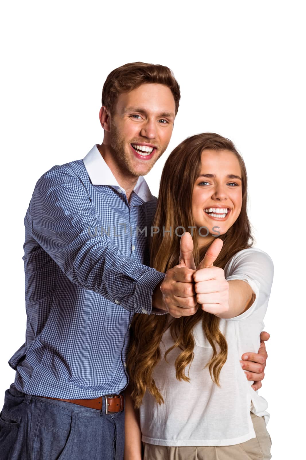 Happy couple gesturing thumbs up by Wavebreakmedia