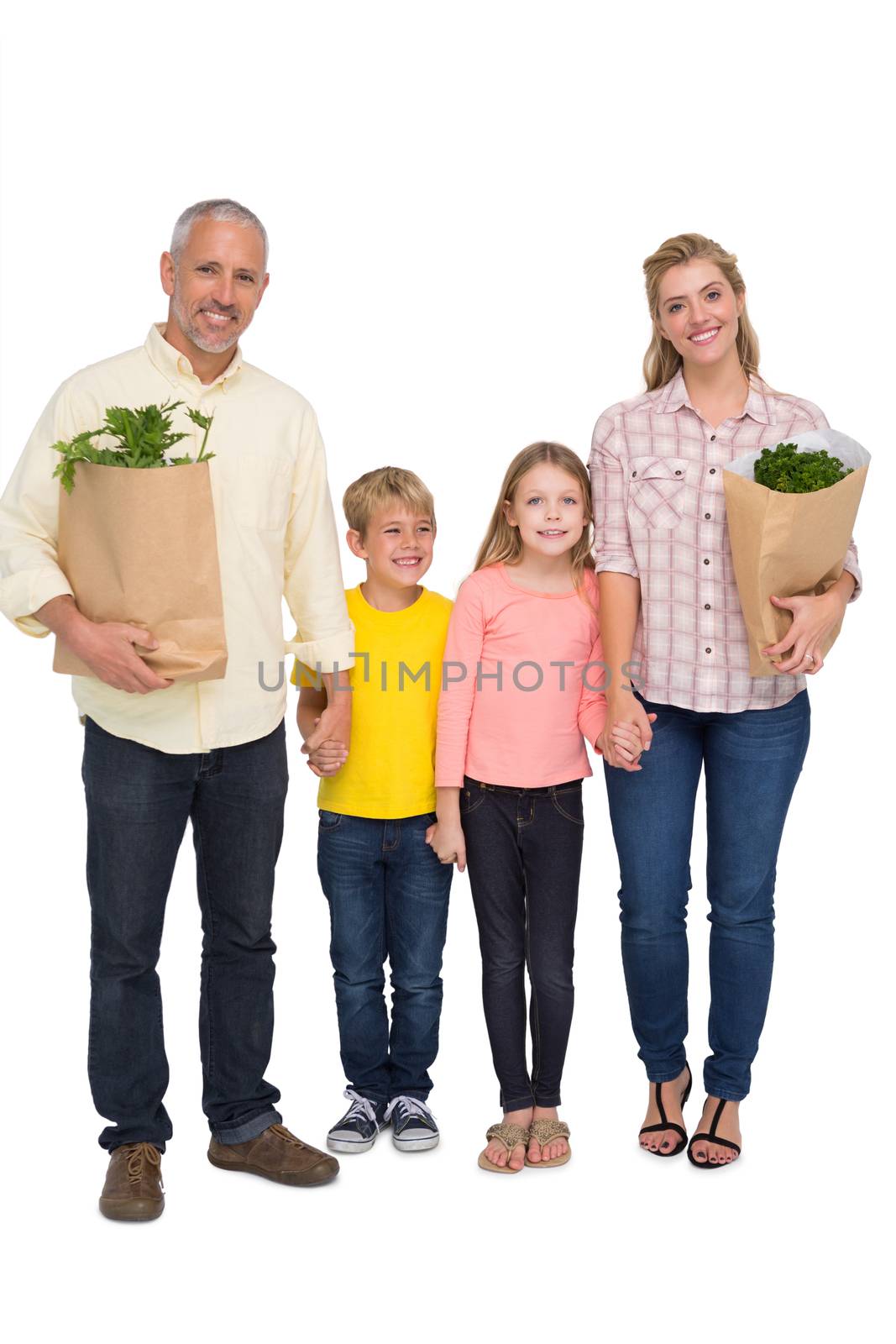 Happy family with grocery bags on white background