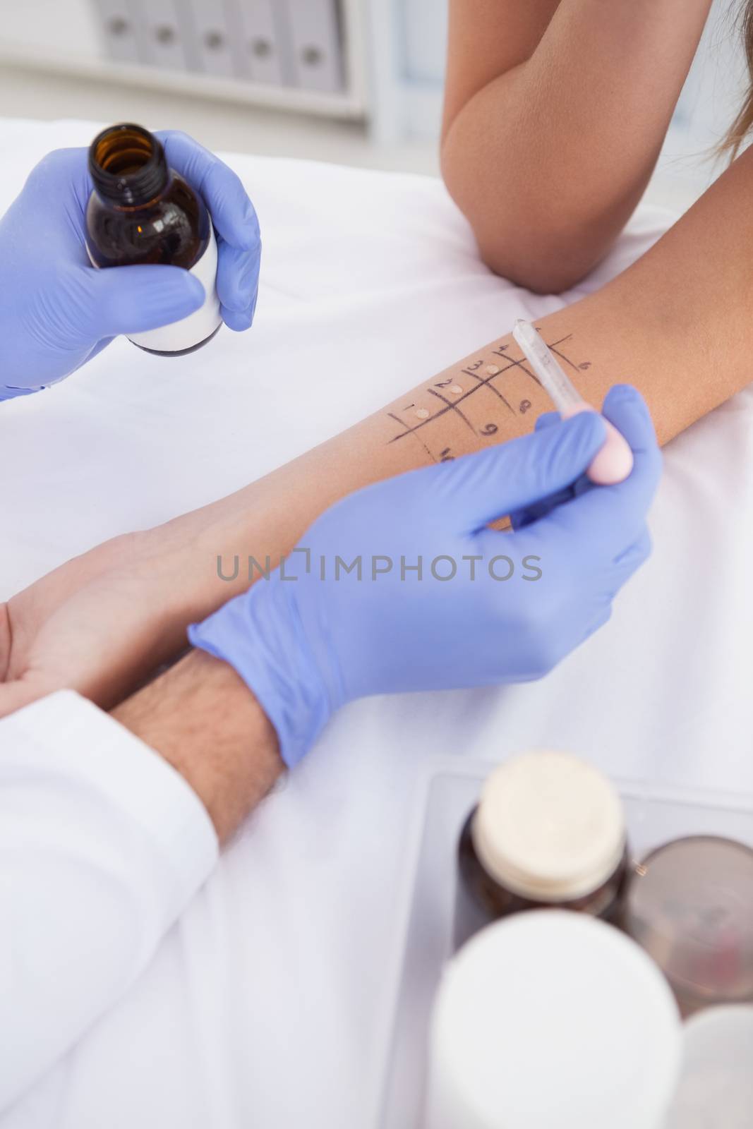 Doctor carrying out a skin prick test by Wavebreakmedia