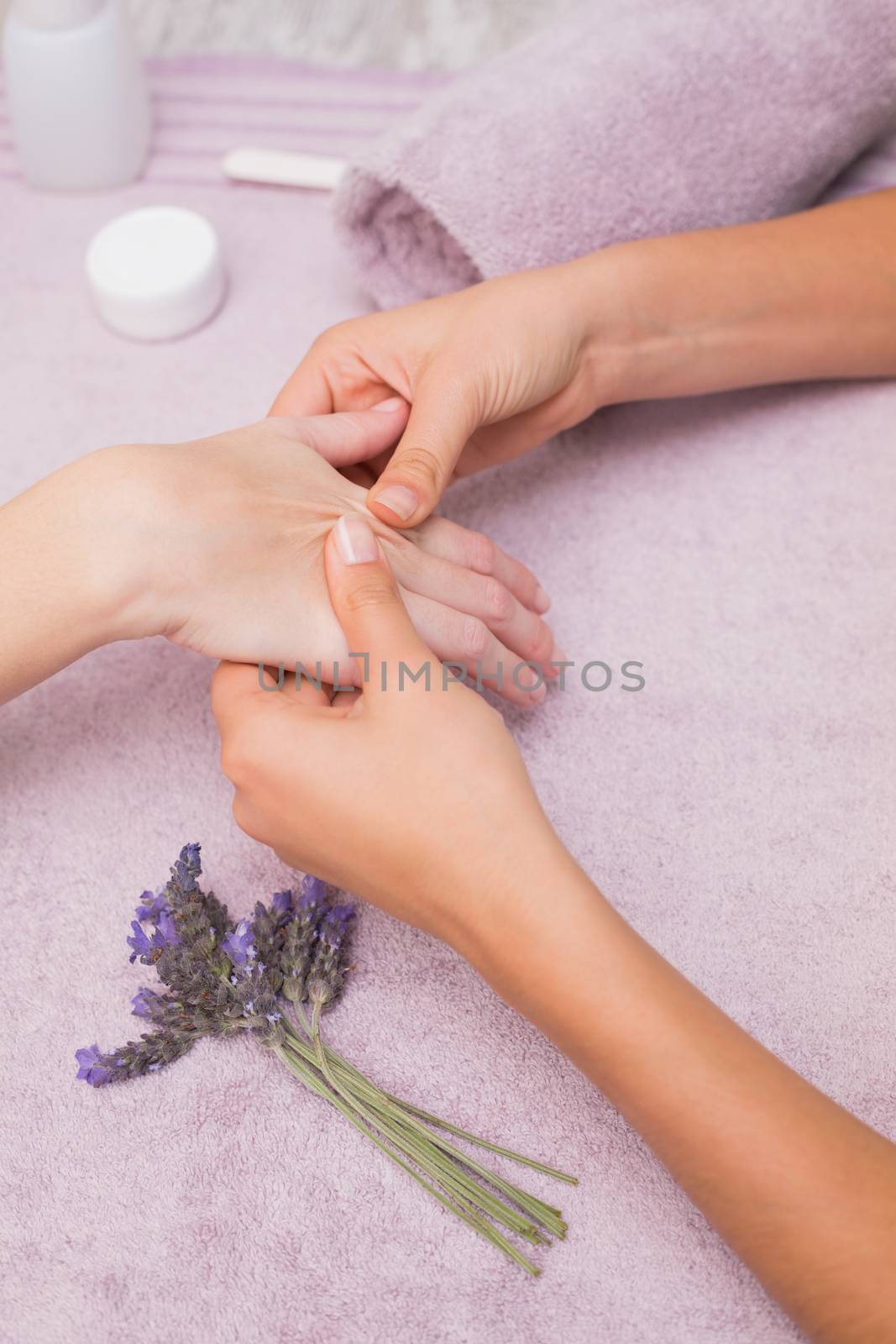 Woman getting a hand massage by Wavebreakmedia