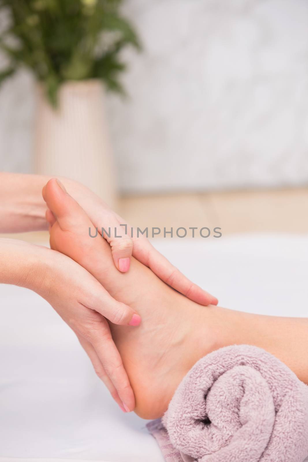 Woman receiving a foot massage at the beauty salon