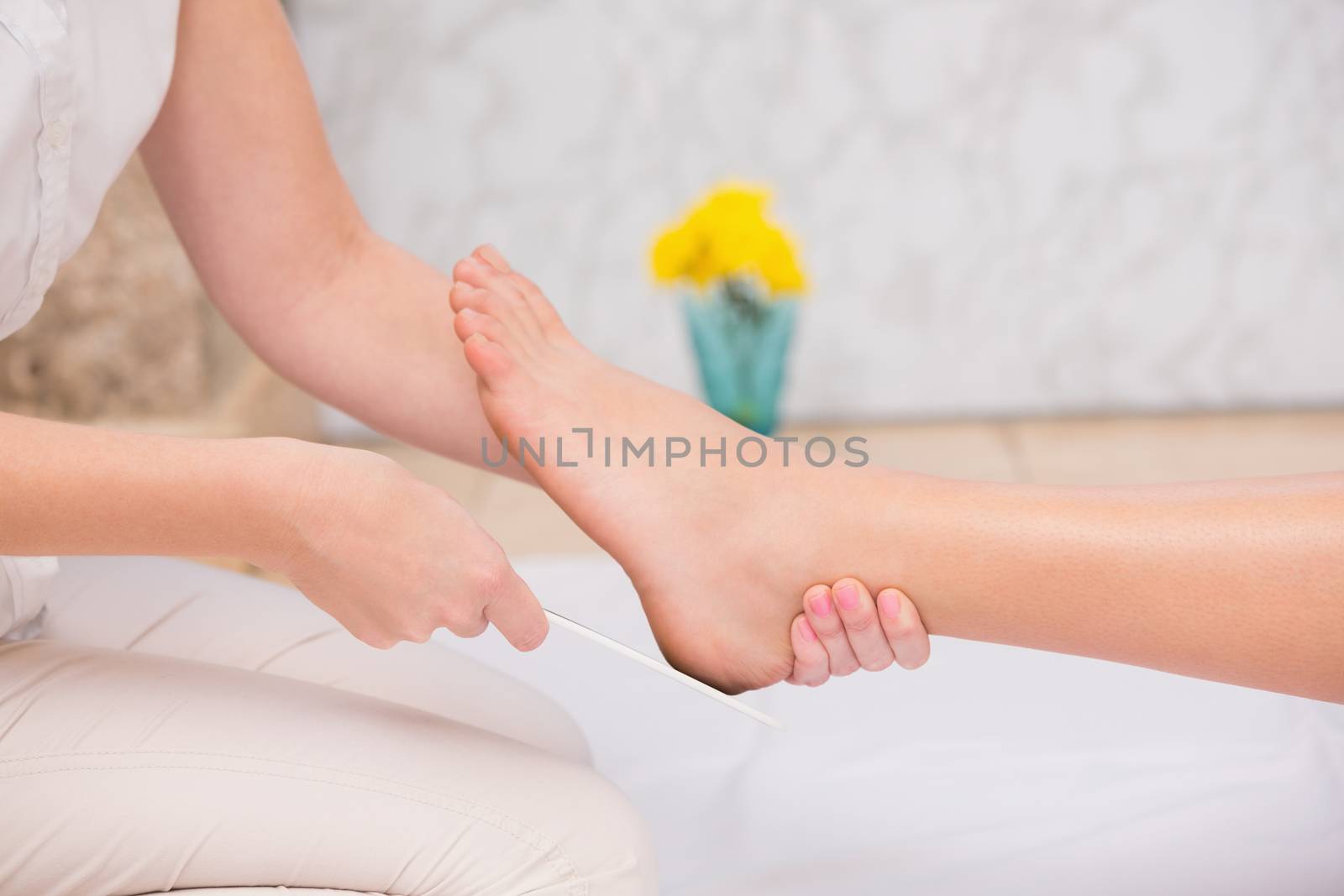 Woman getting a pedicure from beautician by Wavebreakmedia