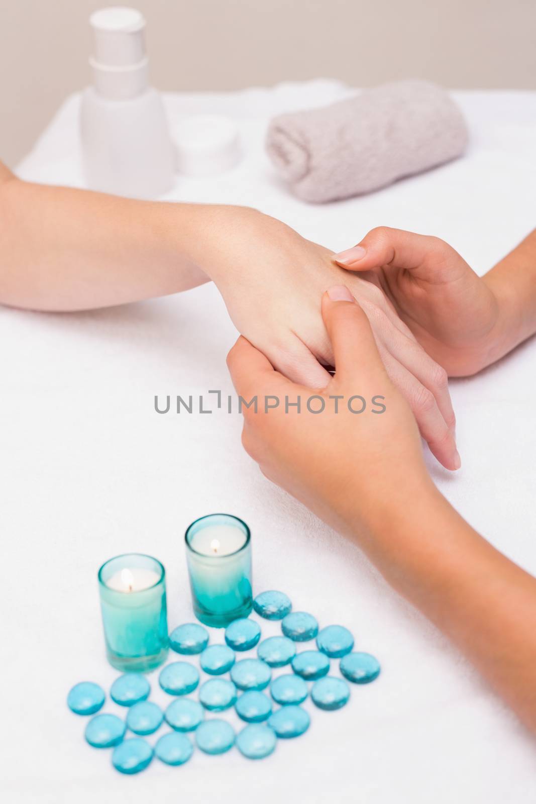 Woman getting a hand massage at the beauty salon