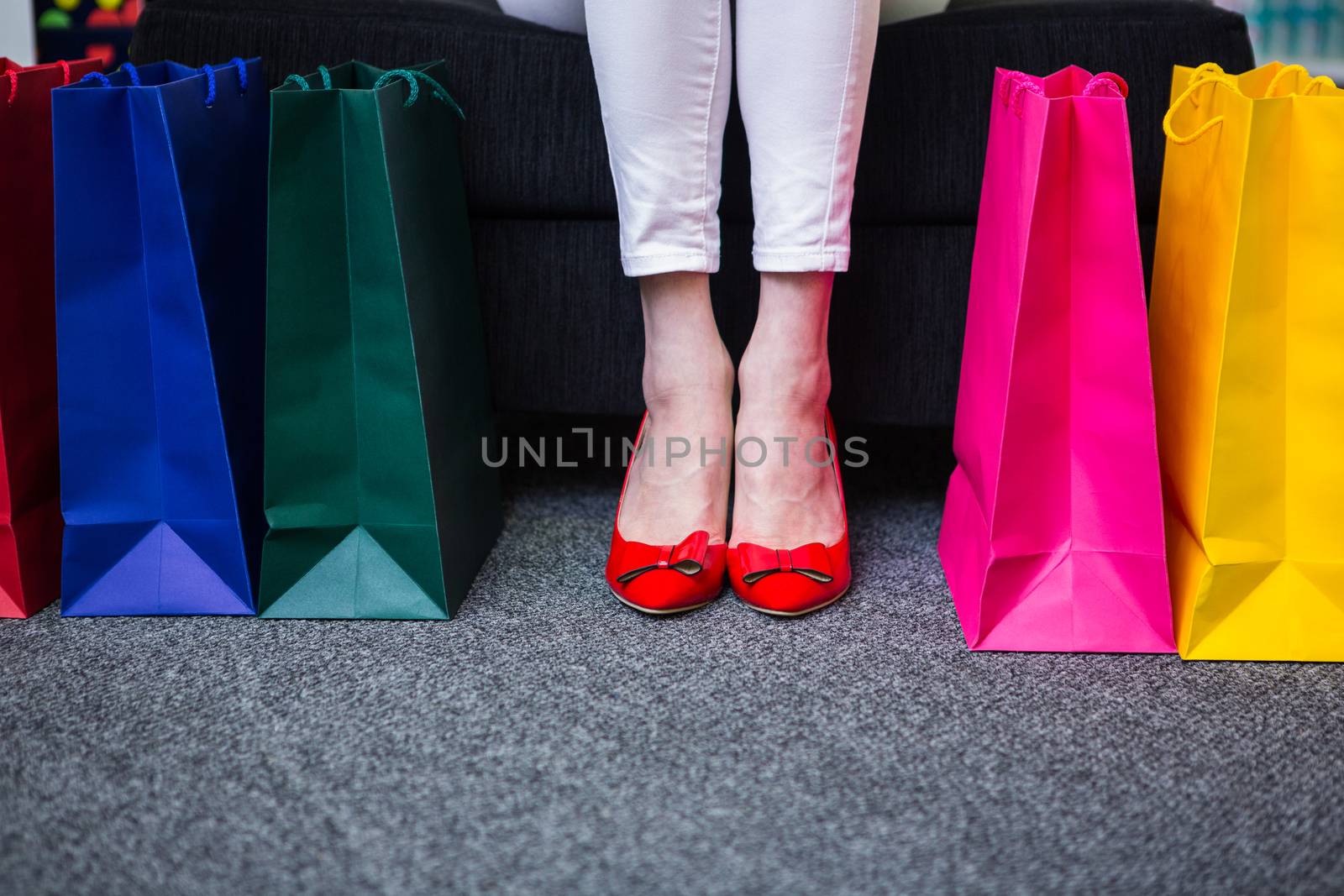Woman holding many shopping bags by Wavebreakmedia