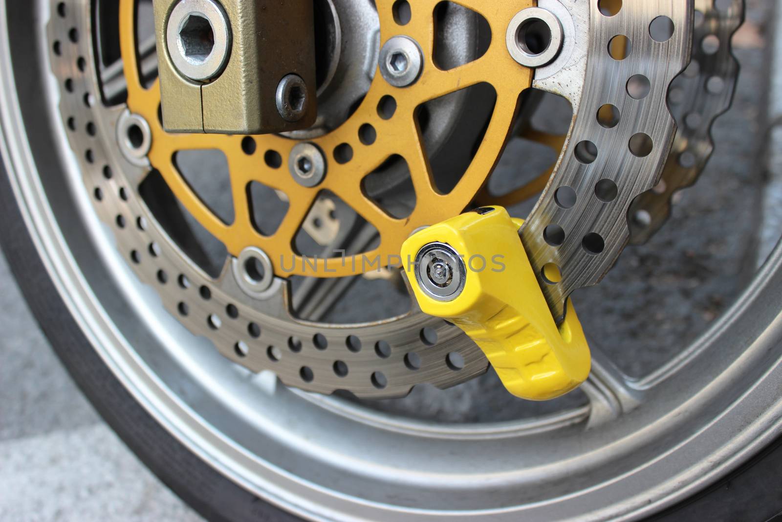 Yellow Disc Lock on Motorbike Disc Brake
