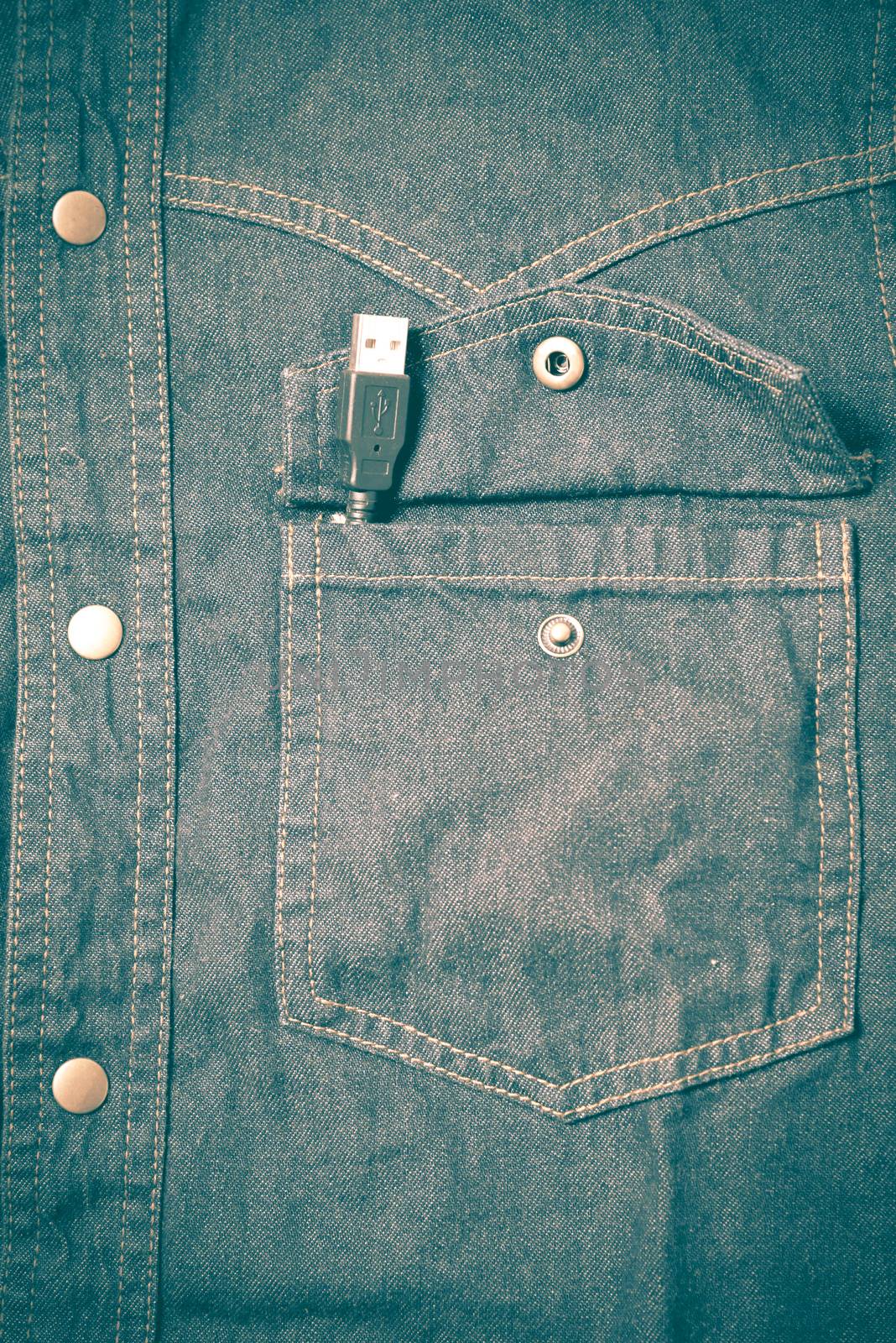 usb cable in jean pocket retro vintage style