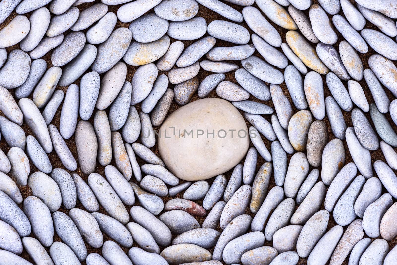 Lot of pebbles around big stone