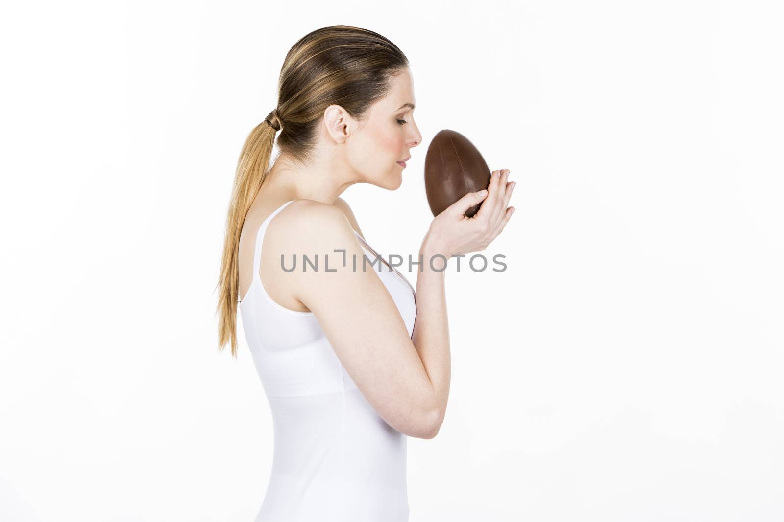 woman holding little chocolate easter egg
