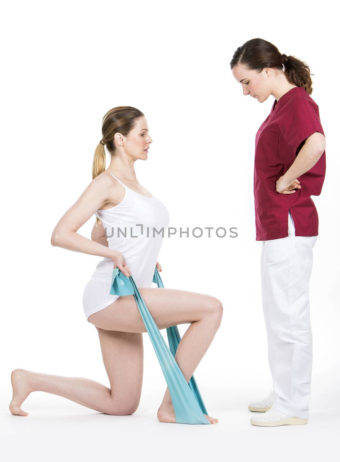 Physiotherapist doing tone with flexible for spine by Flareimage