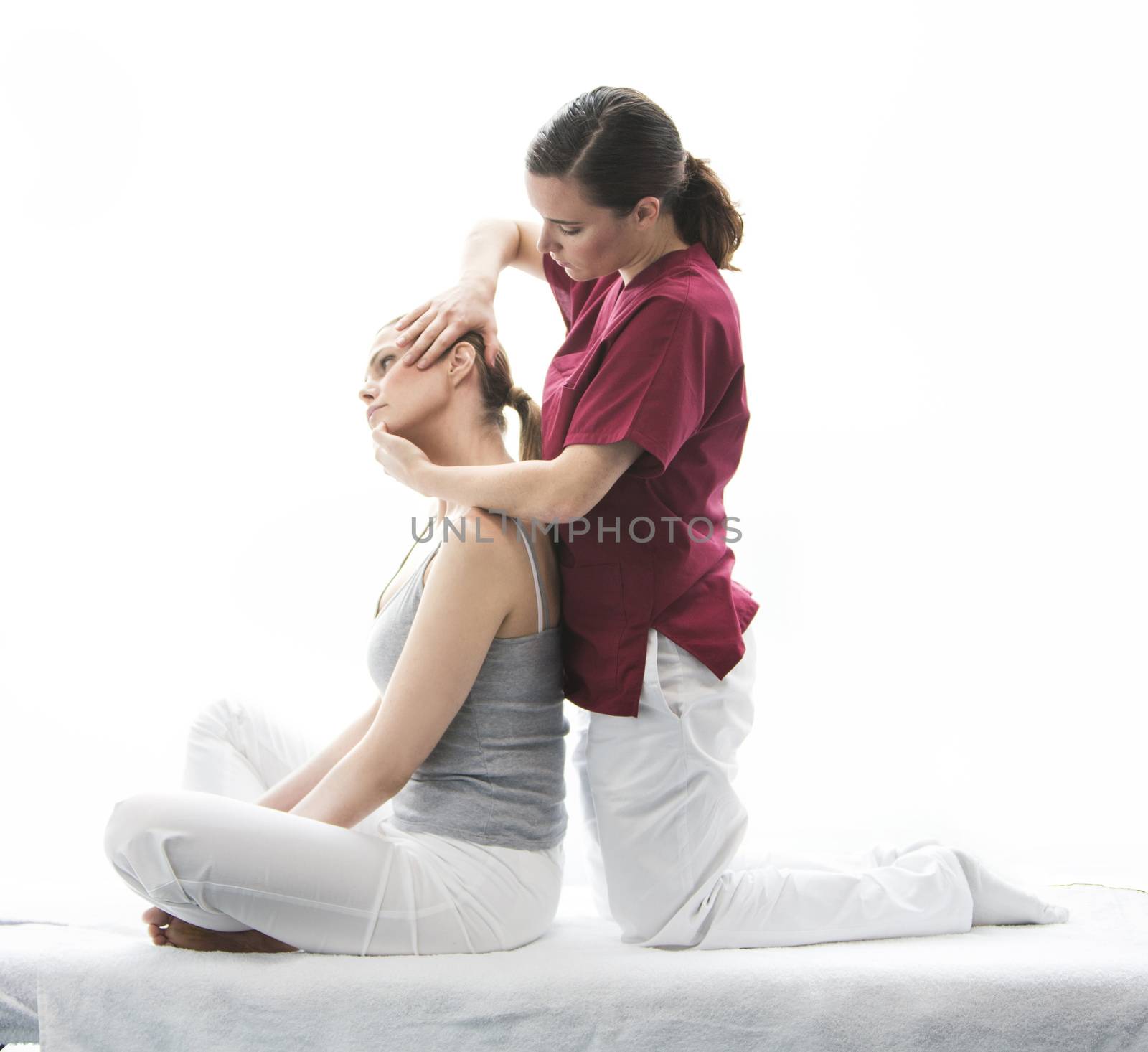 physical therapist with woman patient by Flareimage