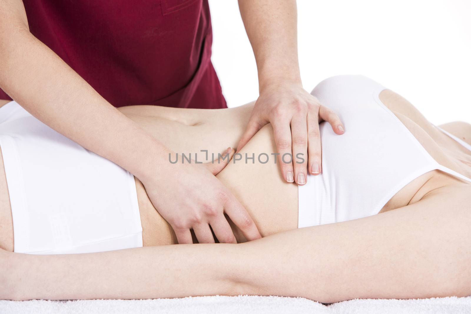 physiotherapist doing a  diaphragm massage to a woman patient