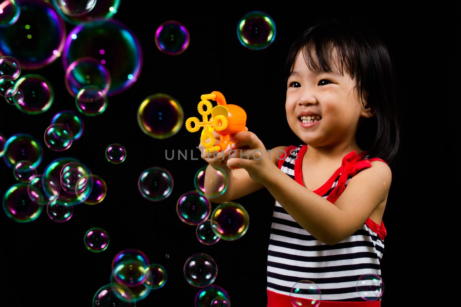Asian Chinese Little Girl Playing Soap Bubbles by kiankhoon