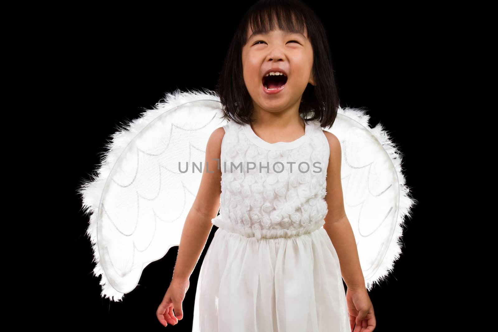 Asian Chinese Little Angel in black background studio shot.