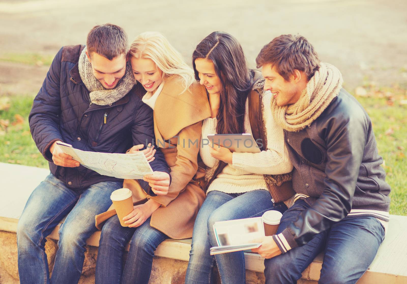 couples with tourist map in autumn park by dolgachov