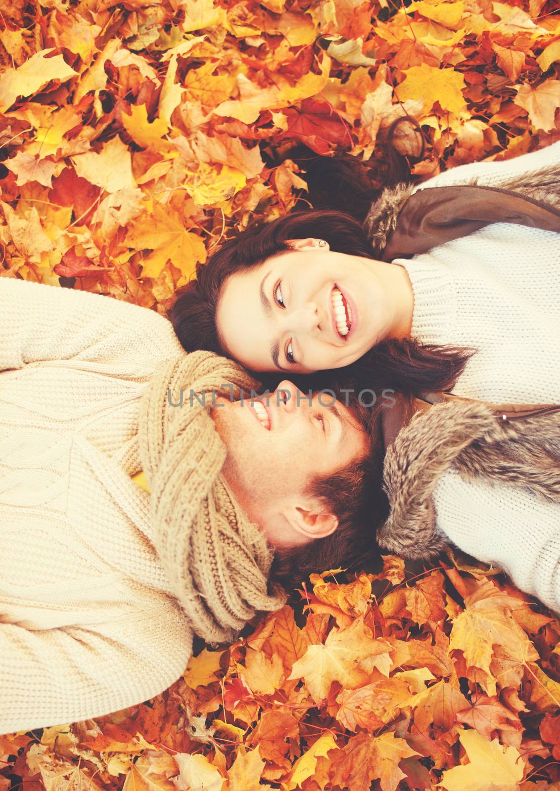 holidays, love, relationship and dating concept - romantic couple in the autumn park