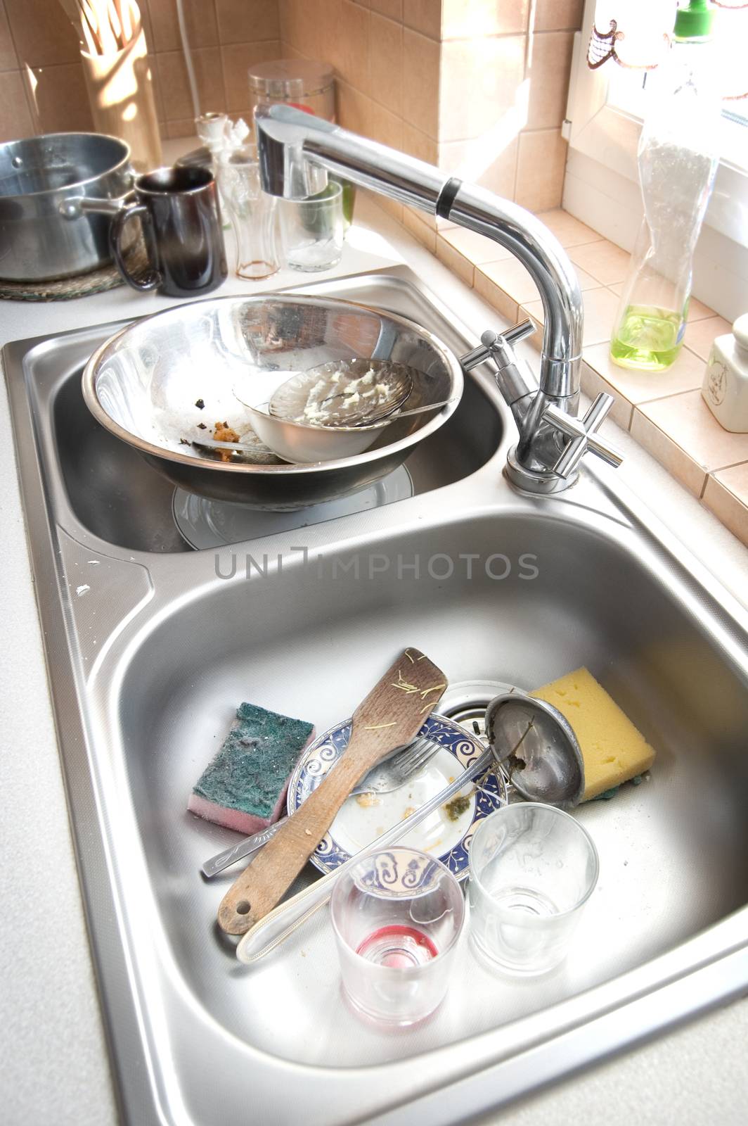 Kitchen conceptual image. Dirty sink with many dirty dishes.