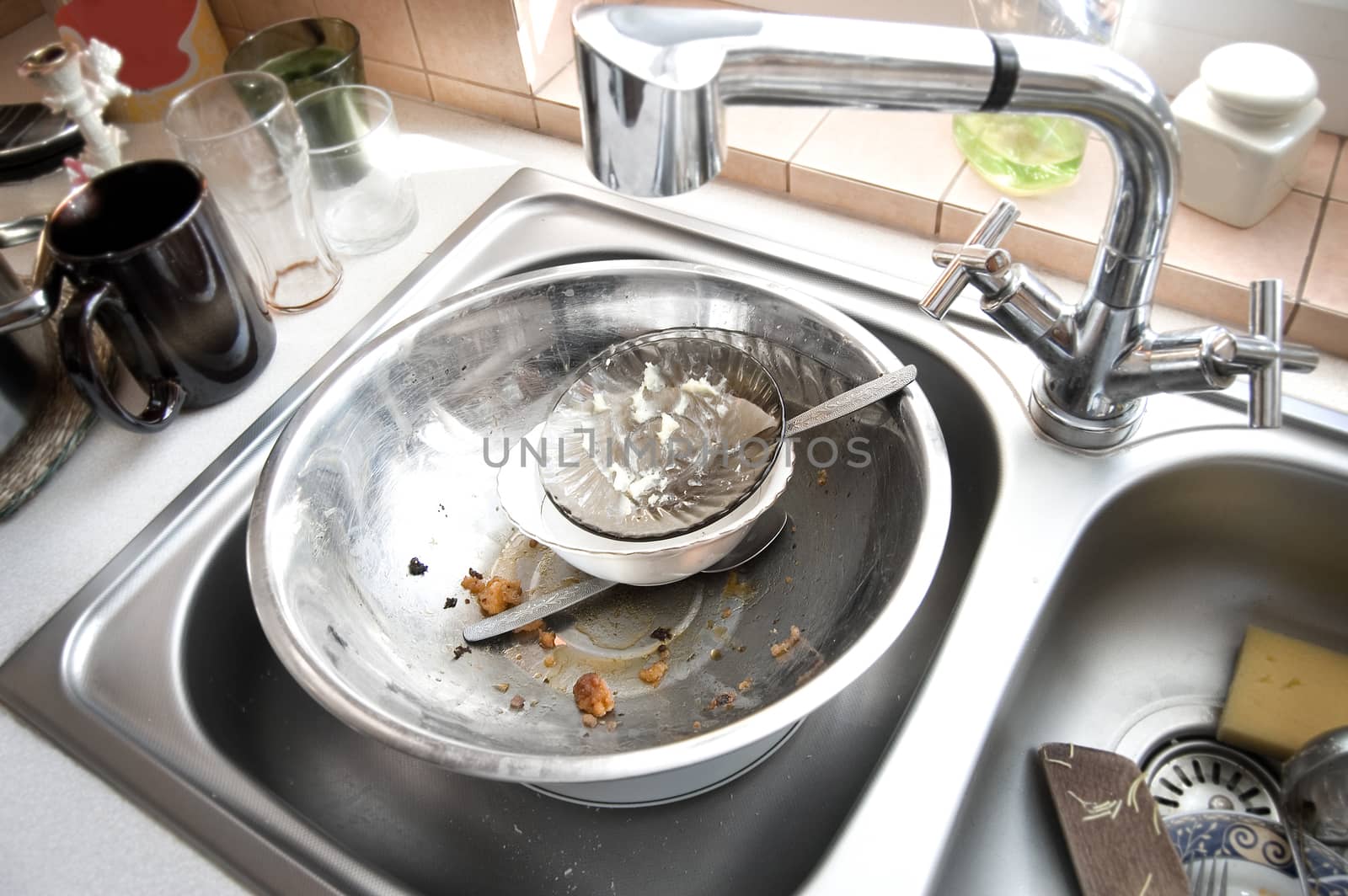 Kitchen conceptual image. Dirty sink with many dirty dishes.