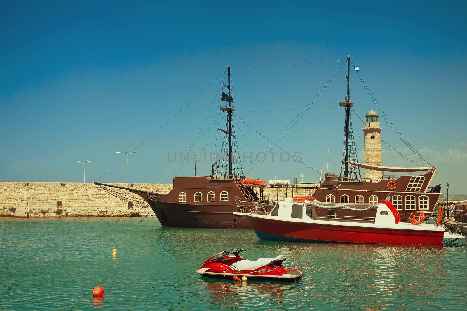 Views of the port and the lighthouse, the town of Rethymno, Cret by georgina198