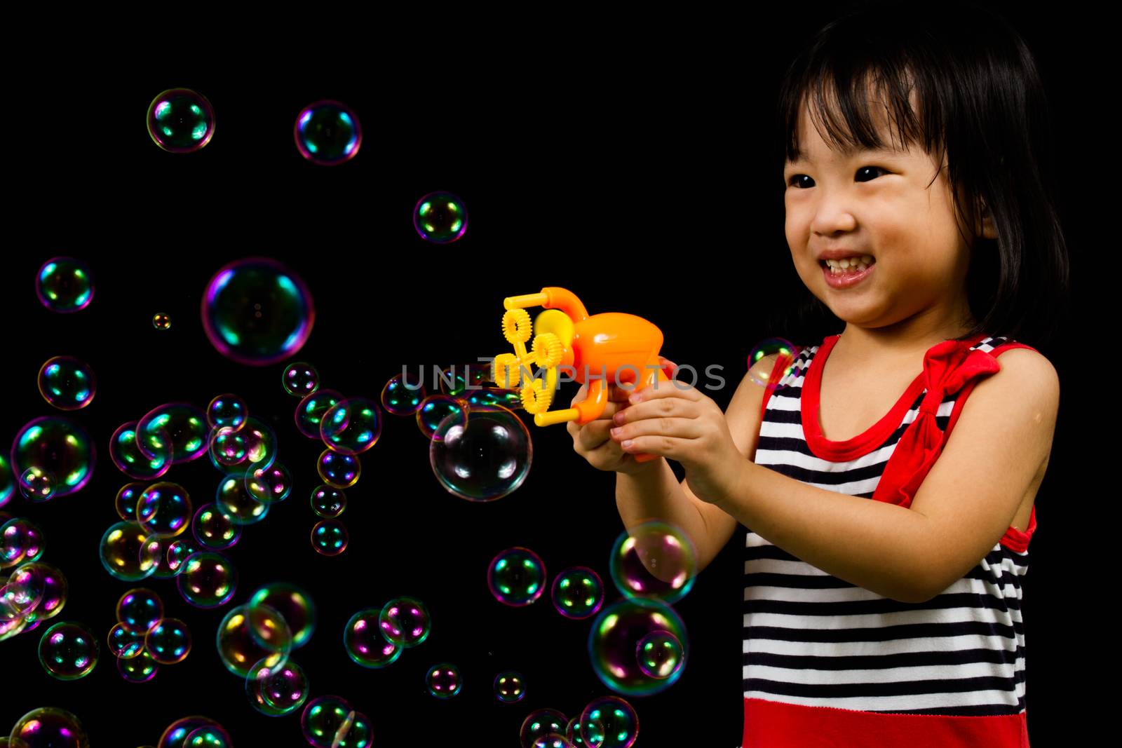 Asian Chinese Little Girl Playing Soap Bubbles by kiankhoon